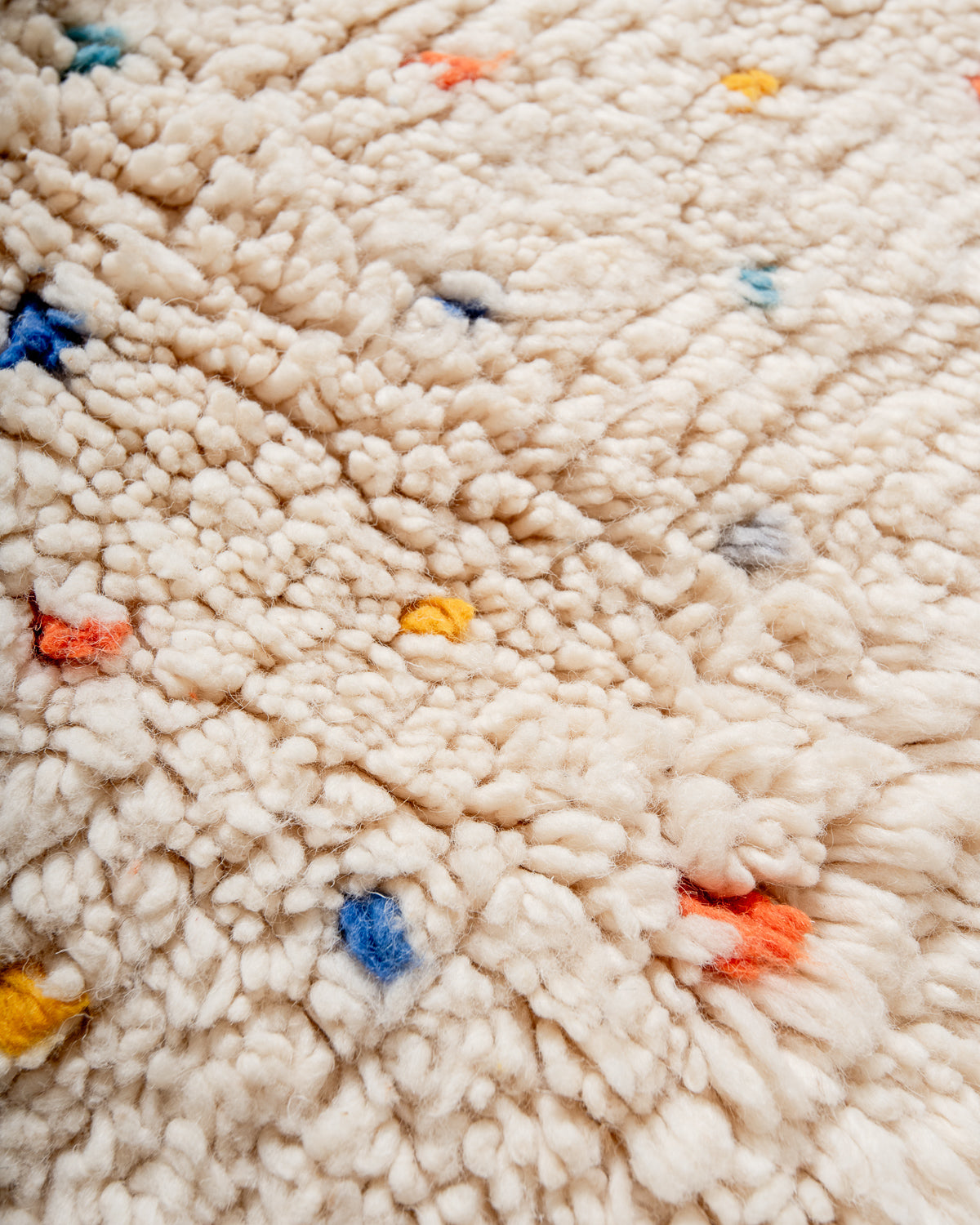 Modern, designer, handcrafted Berber rug from Morocco. Beniourain carpet with beautiful colours and patterns and fluffy wool texture.